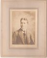 Matted photo of Ernest Herbert Richardson as a young man.